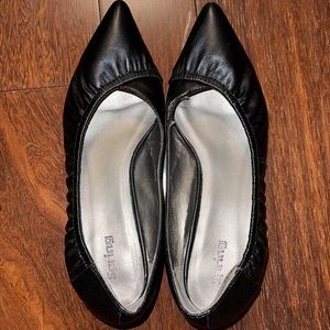 Black pointed leather shoes